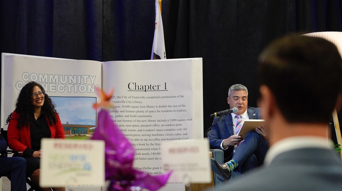 Council Member Mora and City Manager Keith Metzler on stage at the state of the city address
