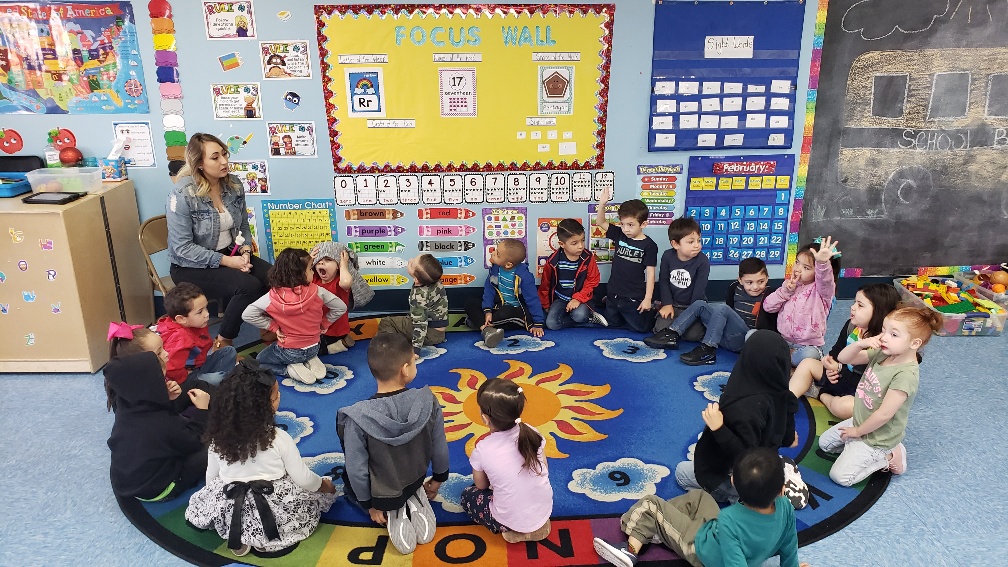 Preschool students on a rug for circle time.