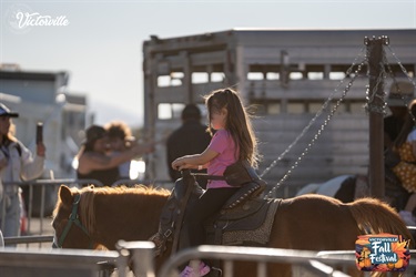 Girl riding pony at Victorville Fall Festival