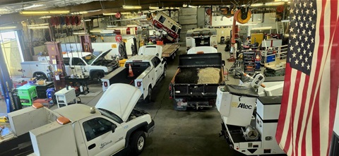 Public Works maintenance shop with City vehicles and equipment being serviced.