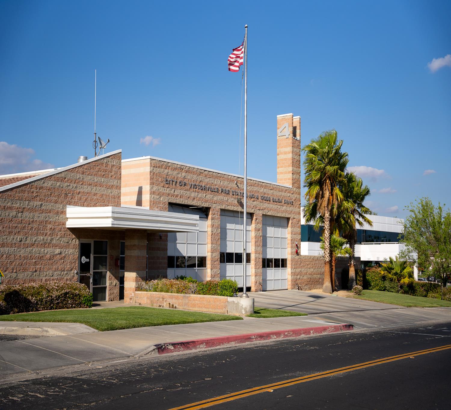 Photo of the street view of fire Station 314 depicting the garage bays and front door