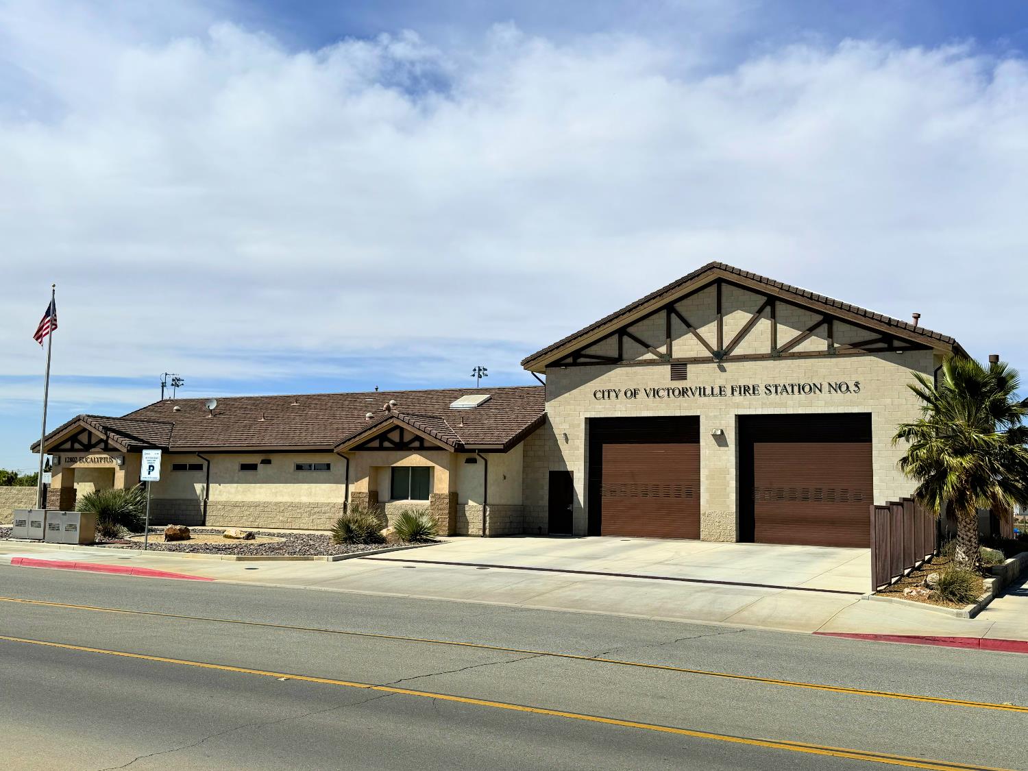Photo of the street view of fire Station 315 depicting the garage bays and front door