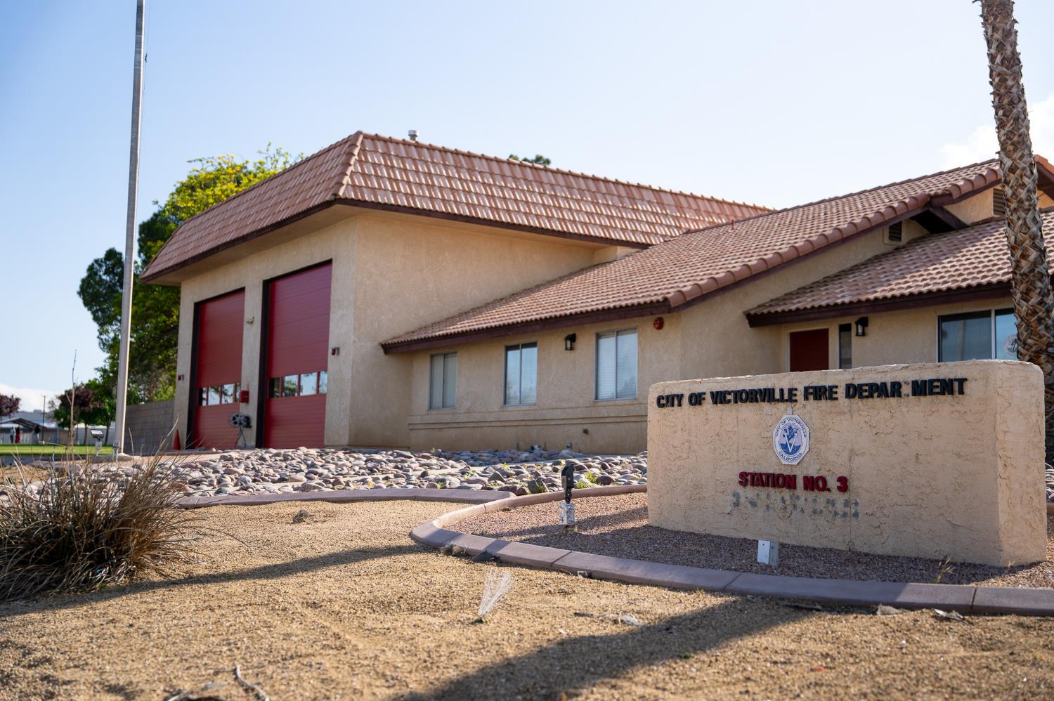 Photo of the street view of fire Station 313 depicting the garage bays and front door